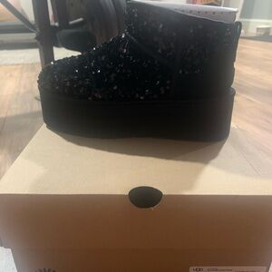 Brand new, never worn size 7 black sequin platform Ugg boots.